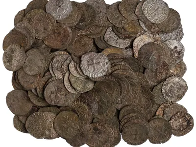 A display of low-value coins from Greece helps illustrate how money became part of ordinary peoples&#39; everyday lives during economic transformation in medieval Europe.