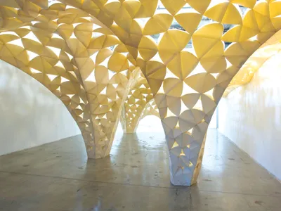 IwamotoScott, Voussoir Cloud, SCIArc Gallery (Los Angeles, California, 2008). PHOTO Judson Terry.

In IwamotoScott Architecture's 2008 installation Voussoir Cloud, heavy wood blocks become translucent petals depending on the changing light of day. The firm won the 2019 National Design Award for Interior Design.