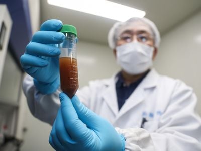 A researcher of Stermirna Therapeutics Co., Ltd. shows the experiment to develop an mRNA vaccine targeting the novel coronavirus in east China's Shanghai.