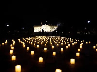 A candlelit vigil on January 13, 2022, in Washington, D.C., for nurses who died during the Covid-19 pandemic. A new study finds that Covid-19 was the leading reason for a growing gap in life expectancy between U.S. men and women from 2019 to 2021.