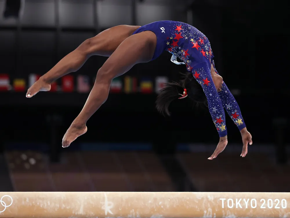 Simone Biles competes on the balance beam at the Tokyo 2020 Olympics