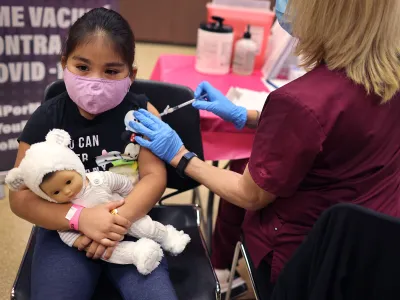 A first grade student receives a Covid-19 vaccine in Chicago, Illinois