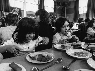 British schoolchildren dig into a lunch of fish sticks in 1974. Since its debut in 1953, the frozen food has proved to be a hit among kids and adults, owing to its palatability, low cost, and convenience.