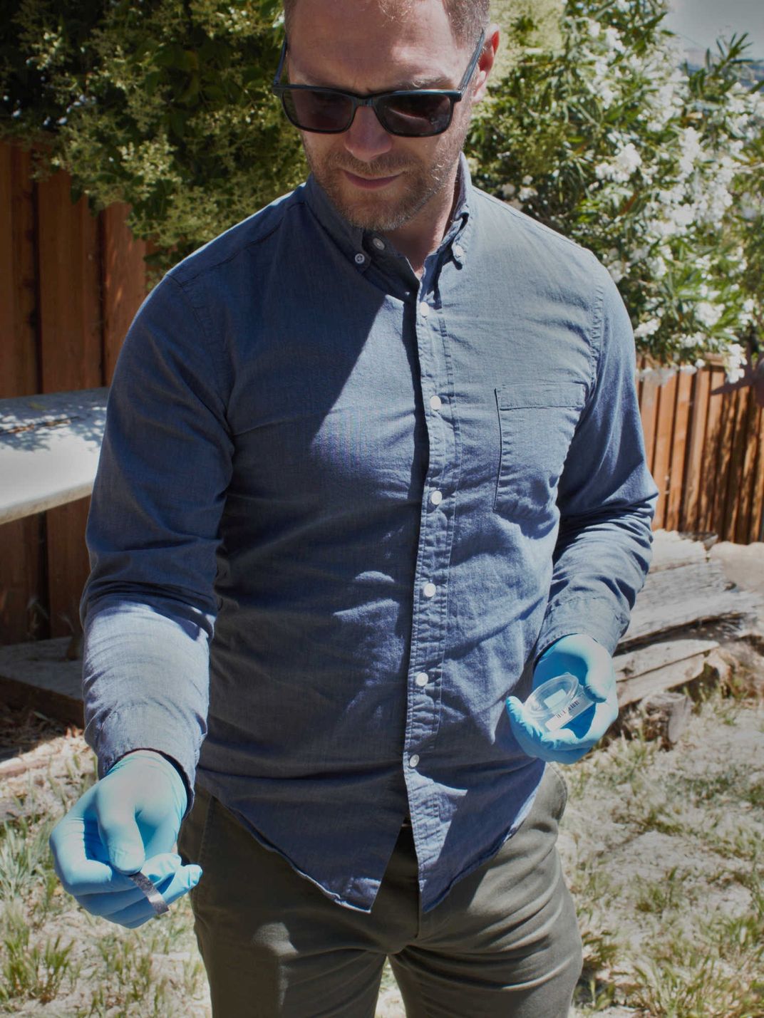 Nicholas Spada holds a piece of graphite tape