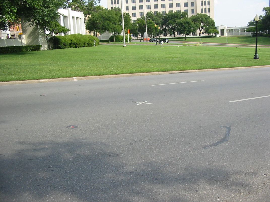 The "X" painted in the center of Elm Street marks where Kennedy was sitting when he was killed.