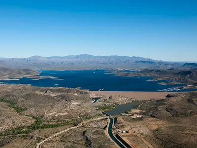 Water-strapped cities with growing populations and energy needs could benefit the most. Greater Phoenix, for instance, is served by this reservoir and irrigation system fed by the Colorado River.