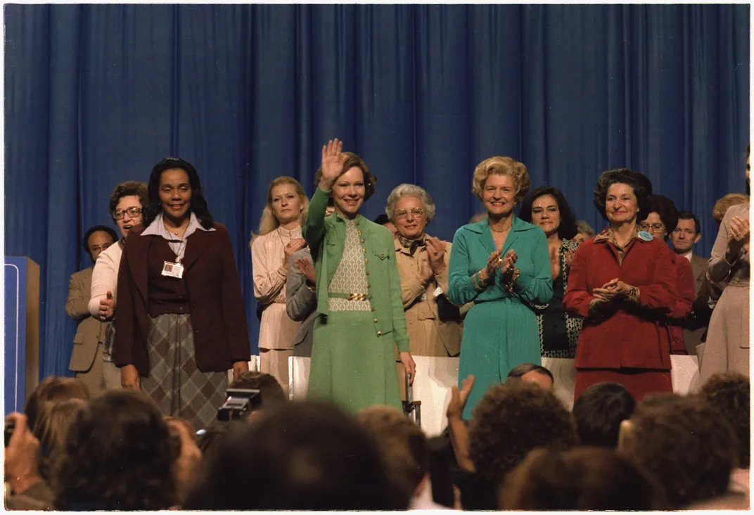 Rosalynn Carter (in green), with Betty Ford (in blue) and Lady Bird Johnson (in red) at the National Women's Conference in 1977