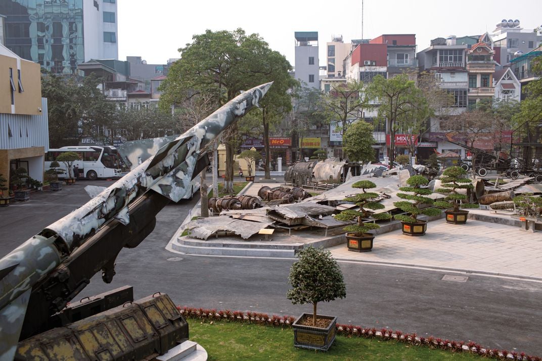 the remains of an airplane wreckage on display in a city square