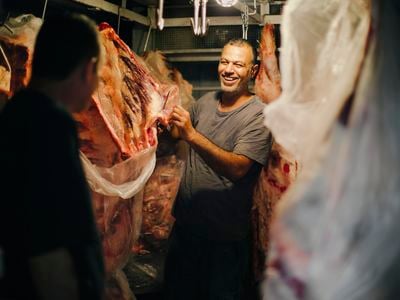 Butcher shop owner Sajad Saleh sells his wares at the Al Tayebat Meat Market. 