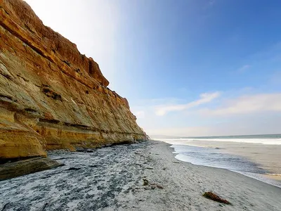 Rain, waves, and seeping groundwater can destabilize seaside bluffs, making them prone to collapse.
